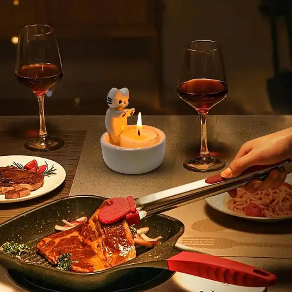 Kitten Candle Holder Warming Its Paws at $9.97 from Odditygadget