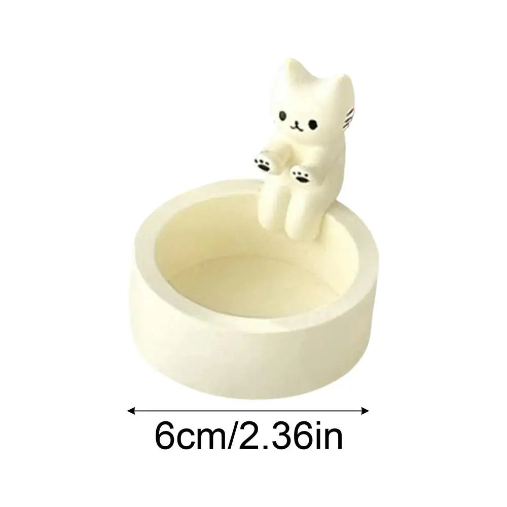 Kitten Candle Holder Warming Its Paws from odditygadget at $9.99