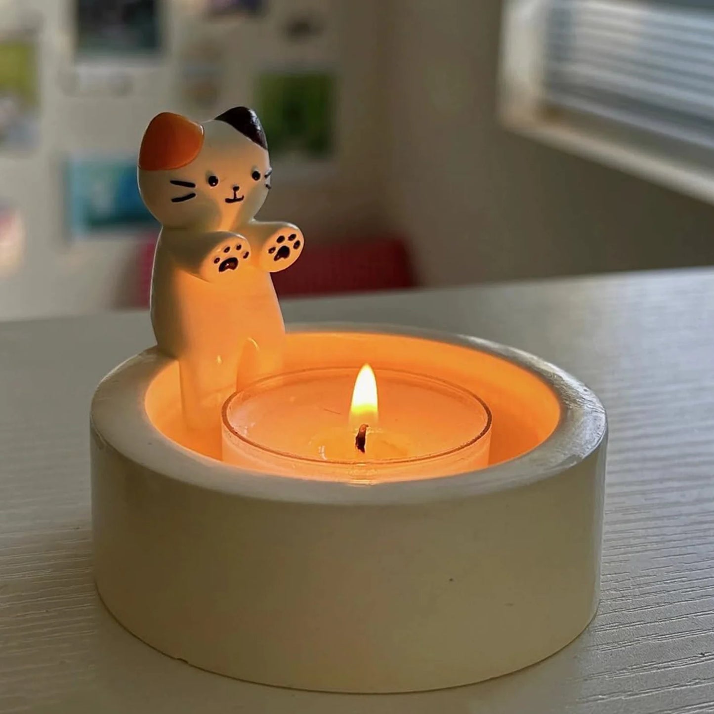 Kitten Candle Holder Warming Its Paws from odditygadget at $9.99