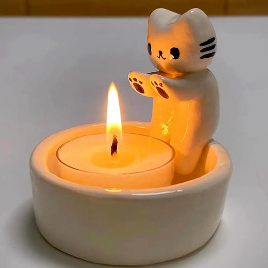 Kitten Candle Holder Warming Its Paws at $9.97 from Odditygadget